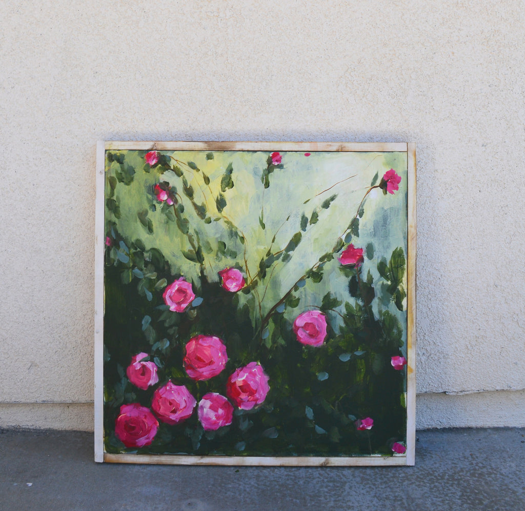 pink roses in a rustic white wood frame